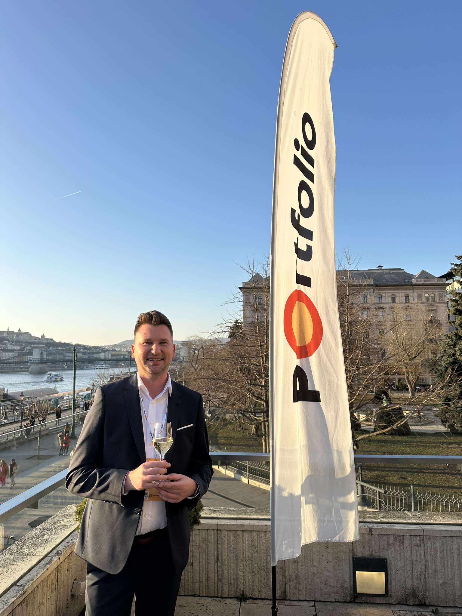 Dr. János Kopasz at Portfolio AI in Business with Budapest in the background