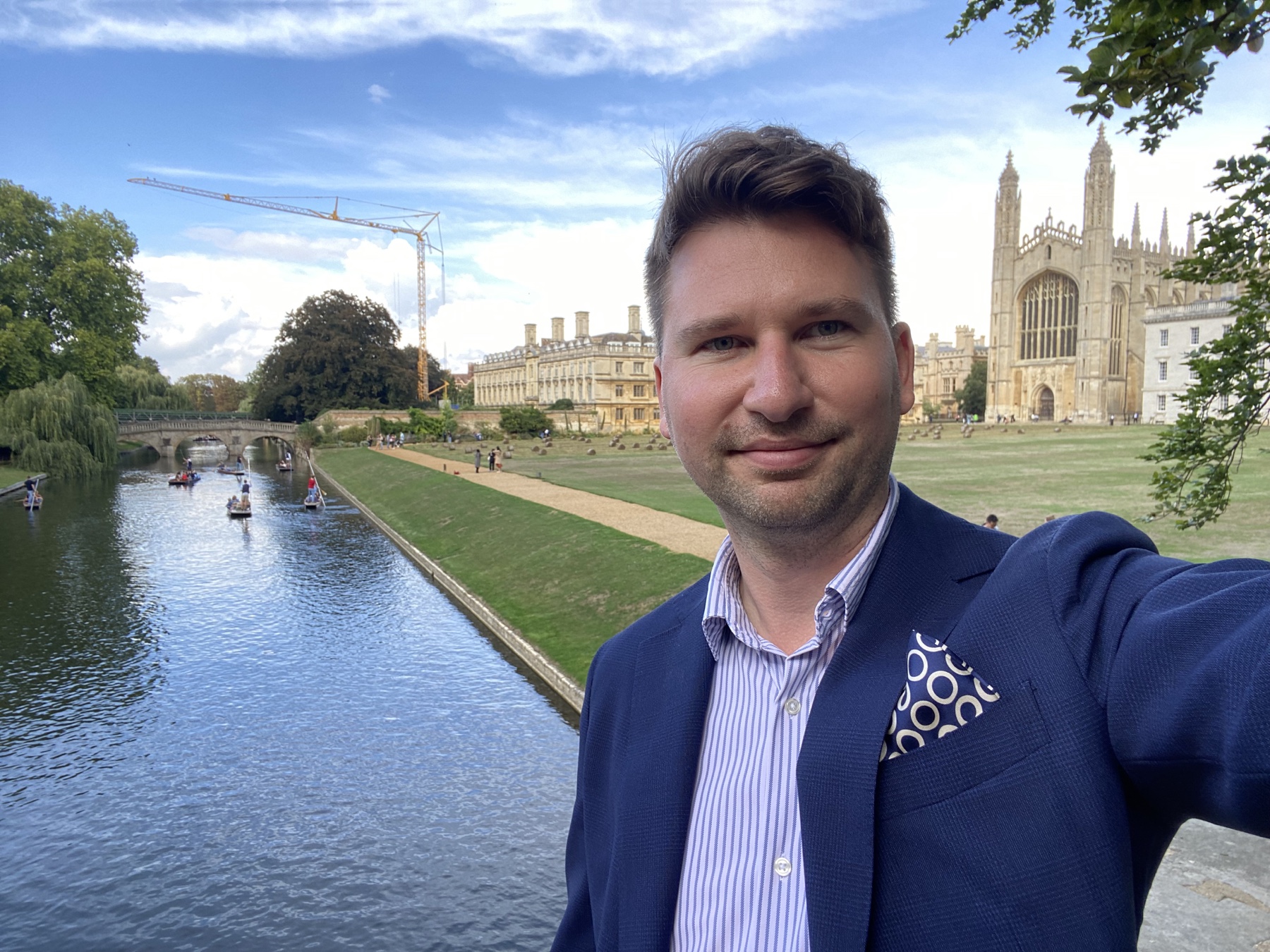 János Kopasz beside the River Cam with King's College Chapel clearly visible in the background
