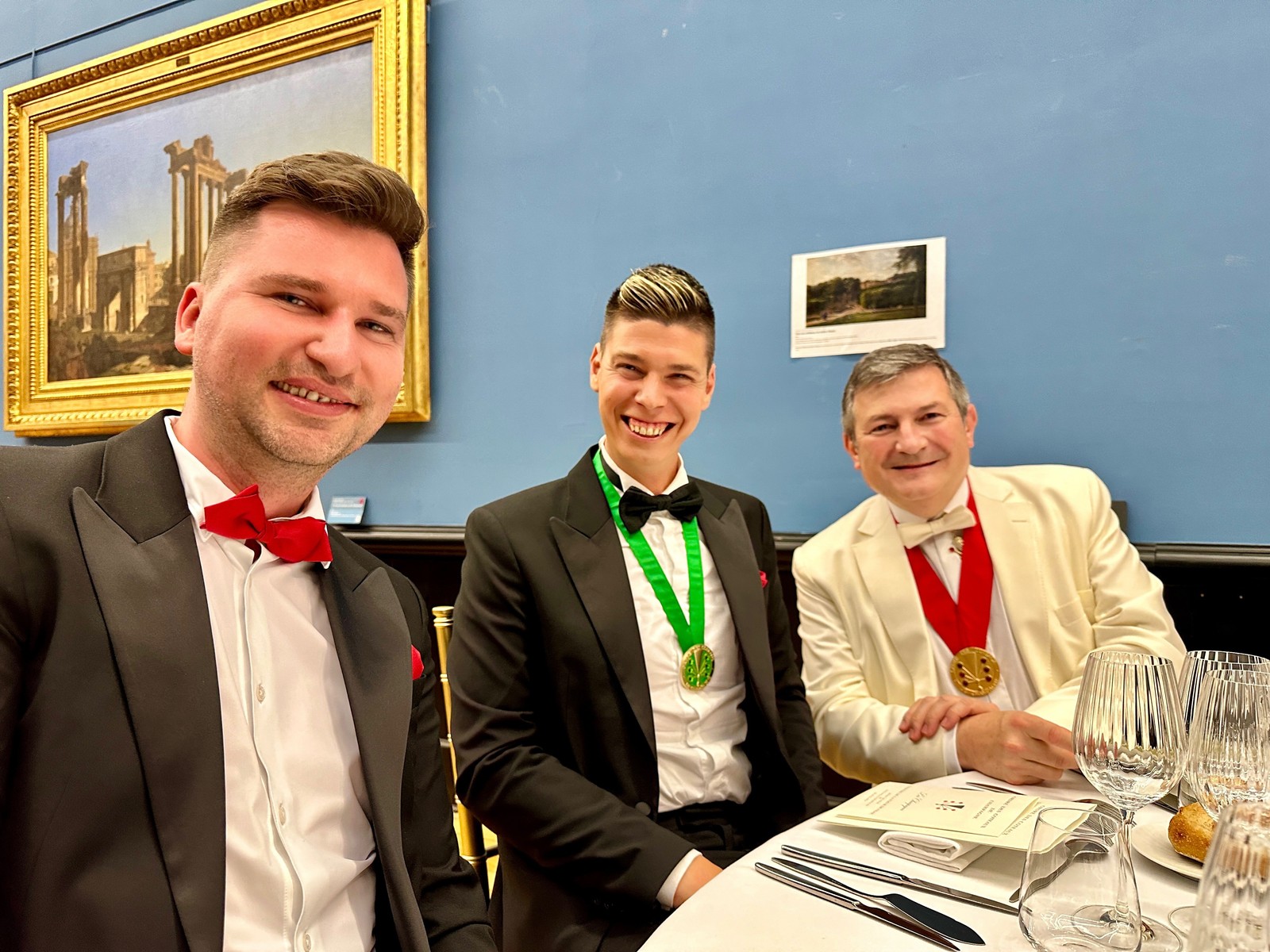 János Kopasz and Máté Hajdu at the Ordre des Coteaux de Champagne table with a fellow chevalier in a white dinner jacket