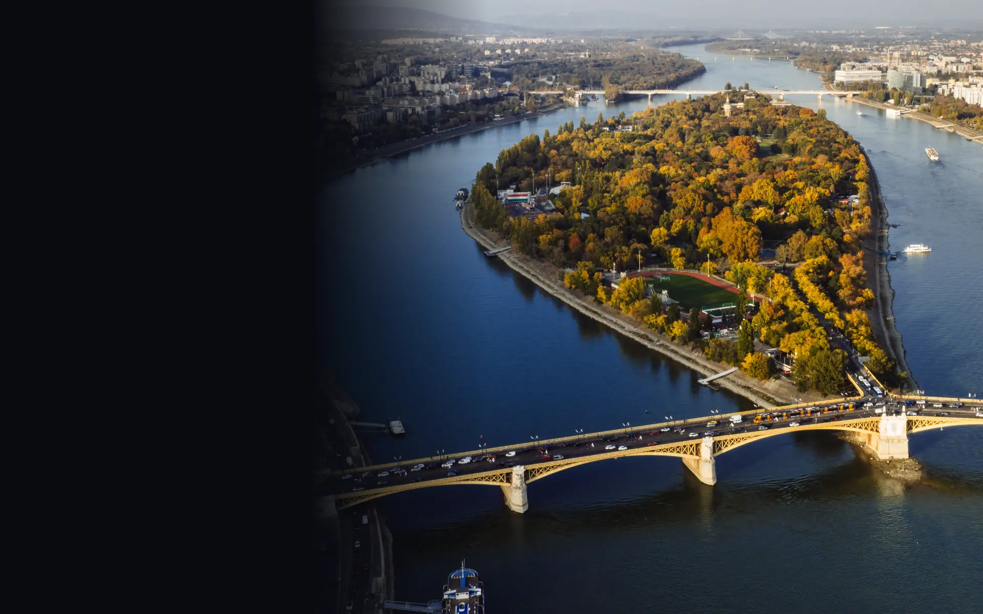Margaret Island in autumn from a drone: the Margaret Bridge in front, the two arms of the Danube behind